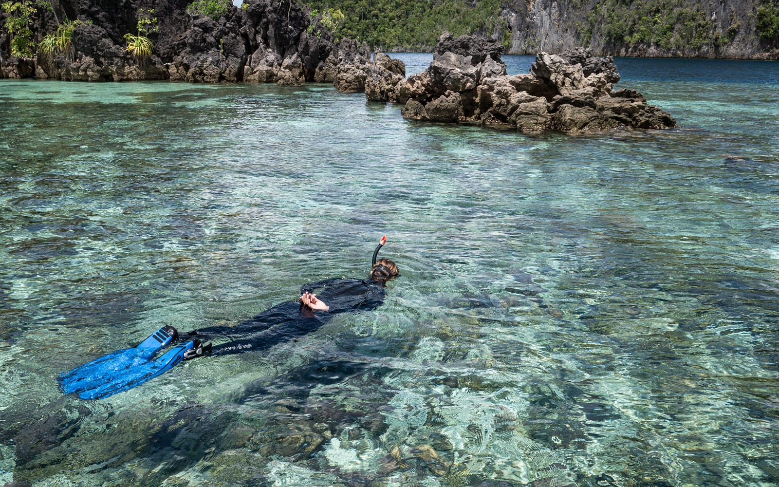 Snorkeler photographed by Snorkel Vacations on a snorkeling trip to Raja Ampat
